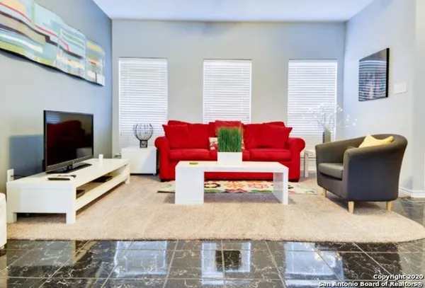 a view of a livingroom with furniture and window