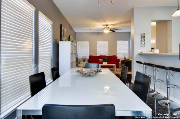 a large kitchen with a table and chairs