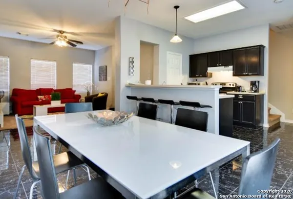 a kitchen with a stove microwave and cabinets