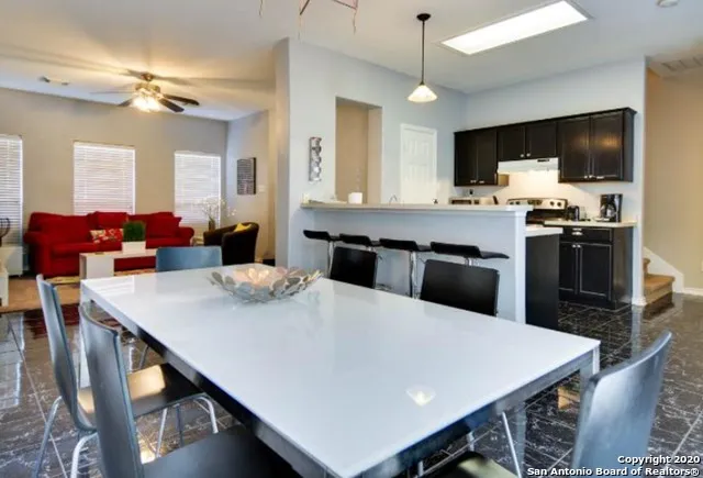 a kitchen with a stove microwave and cabinets