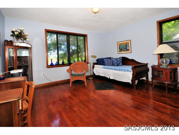 73 Magnolia Avenue St. Augustine, FL 32084 - Photo 11 of 22 a living room with furniture and a wooden floor