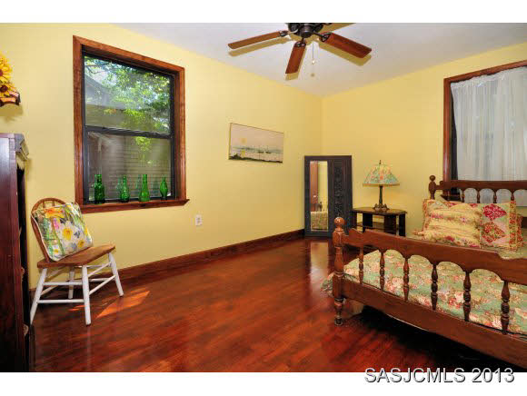 73 Magnolia Avenue St. Augustine, FL 32084 - Photo 13 of 22 a view of a bedroom with furniture and window
