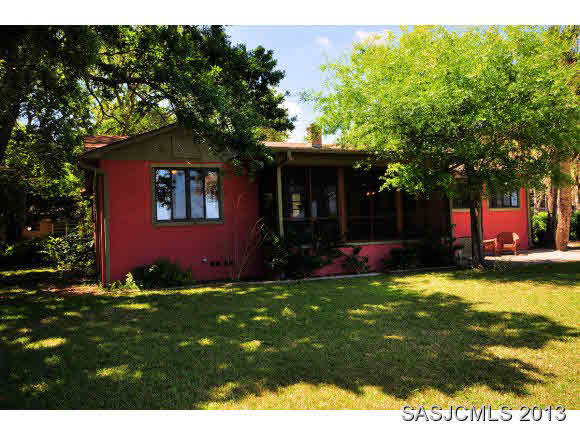 73 Magnolia Avenue St. Augustine, FL 32084 - Photo 20 of 22 a view of an house with floor to ceiling yard and a tree
