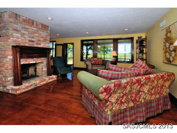 73 Magnolia Avenue St. Augustine, FL 32084 - Photo 4 of 22 a living room with furniture and a fireplace