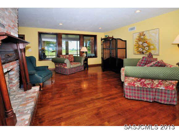 73 Magnolia Avenue St. Augustine, FL 32084 - Photo 5 of 22 a living room with furniture and a fireplace