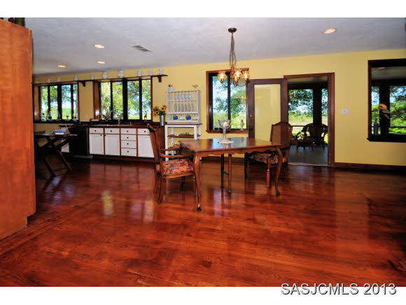 73 Magnolia Avenue St. Augustine, FL 32084 - Photo 6 of 22 a living room with lots of furniture kitchen view and a large window