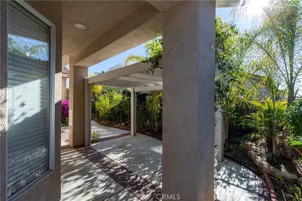 a view of a porch of a house with a patio
