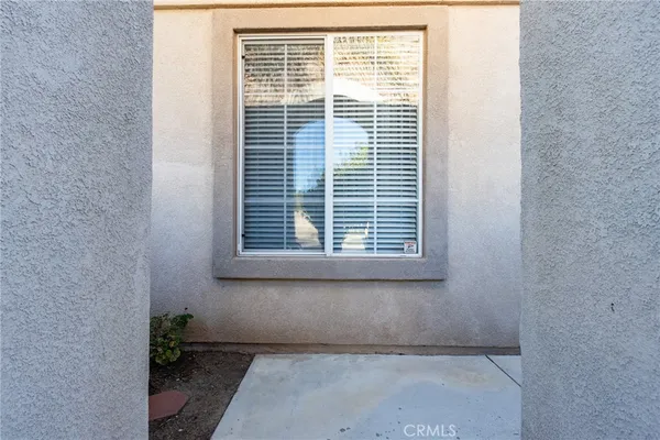 a view of a room that has a window in it