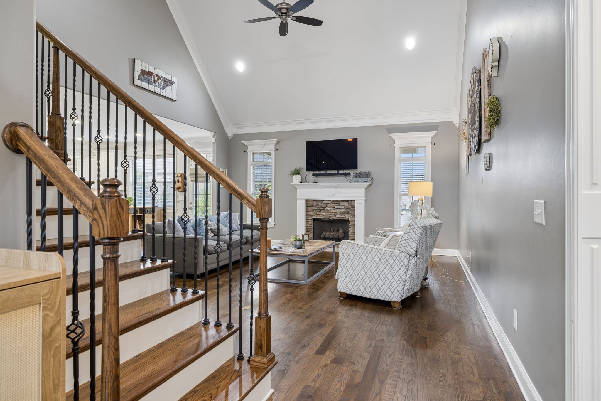 7005 Salmon Run Spring Hill, TN 37174 - Photo 16 of 85 a living room with furniture fireplace and a flat screen tv