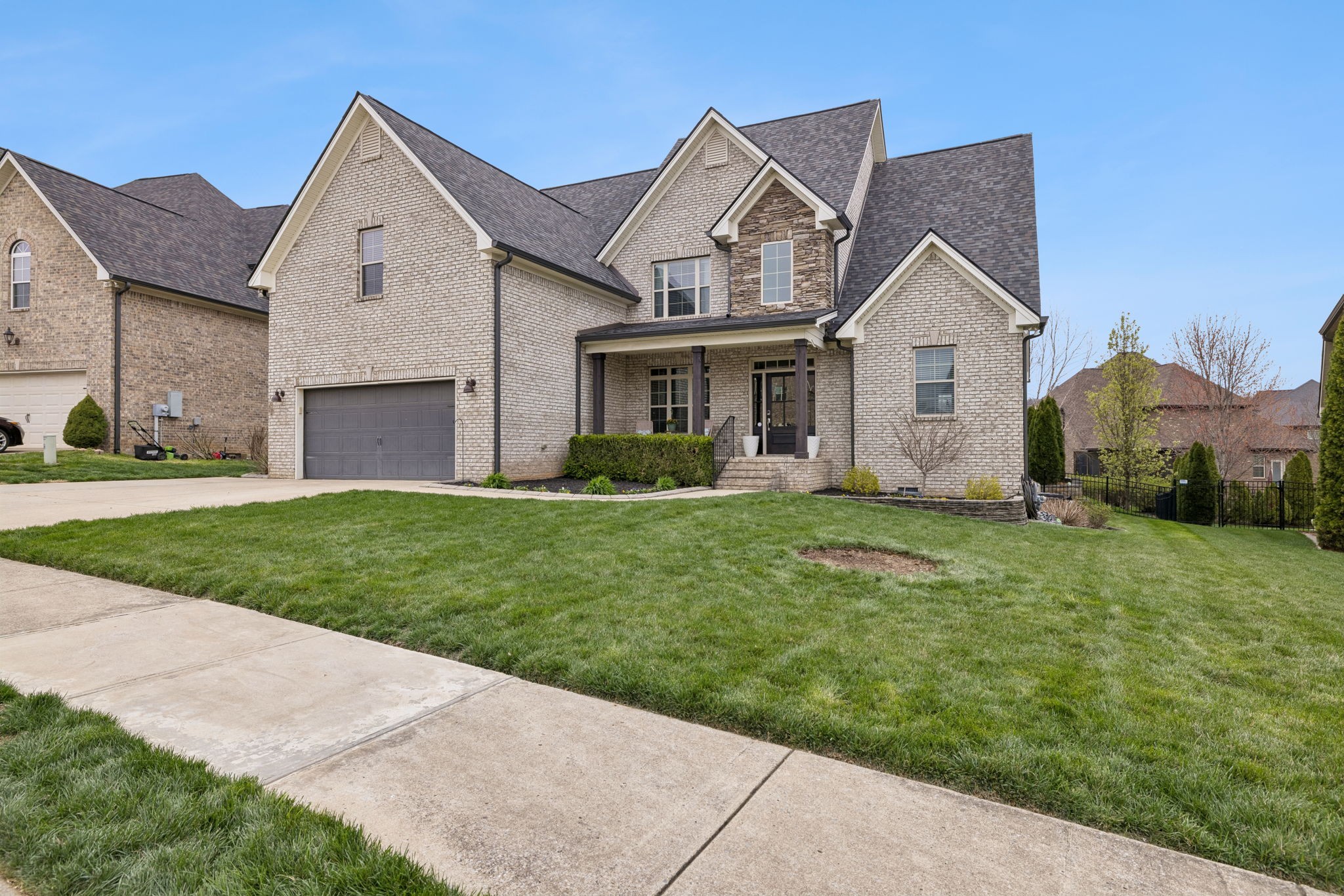 7005 Salmon Run Spring Hill, TN 37174 - Photo 2 of 85 a front view of a house with a yard and garage