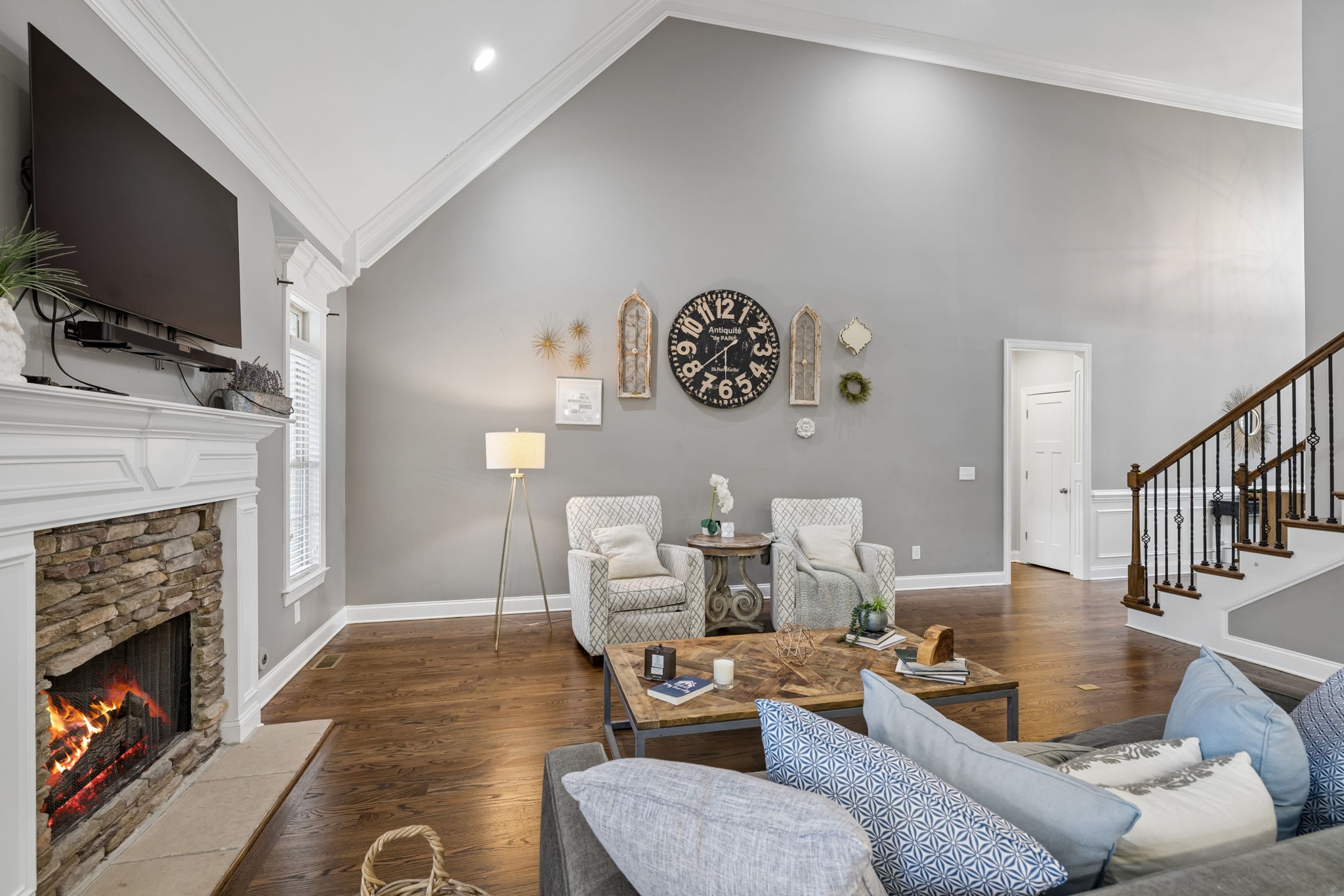 7005 Salmon Run Spring Hill, TN 37174 - Photo 21 of 85 a living room with furniture a flat screen tv and a fireplace