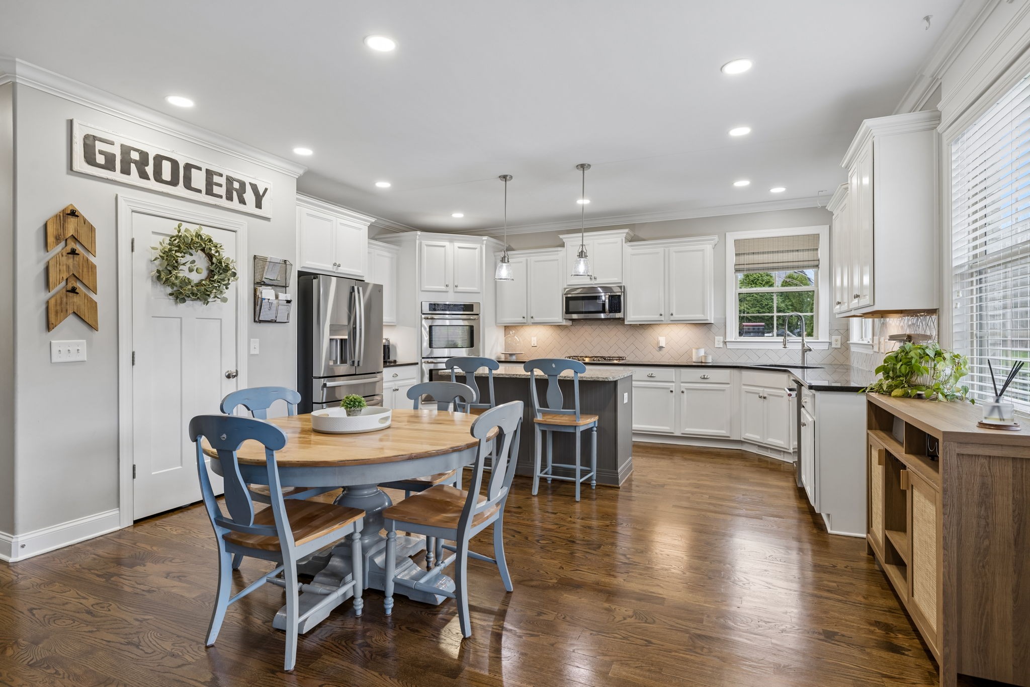 7005 Salmon Run Spring Hill, TN 37174 - Photo 29 of 85 a view of a dining room with furniture and wooden floor