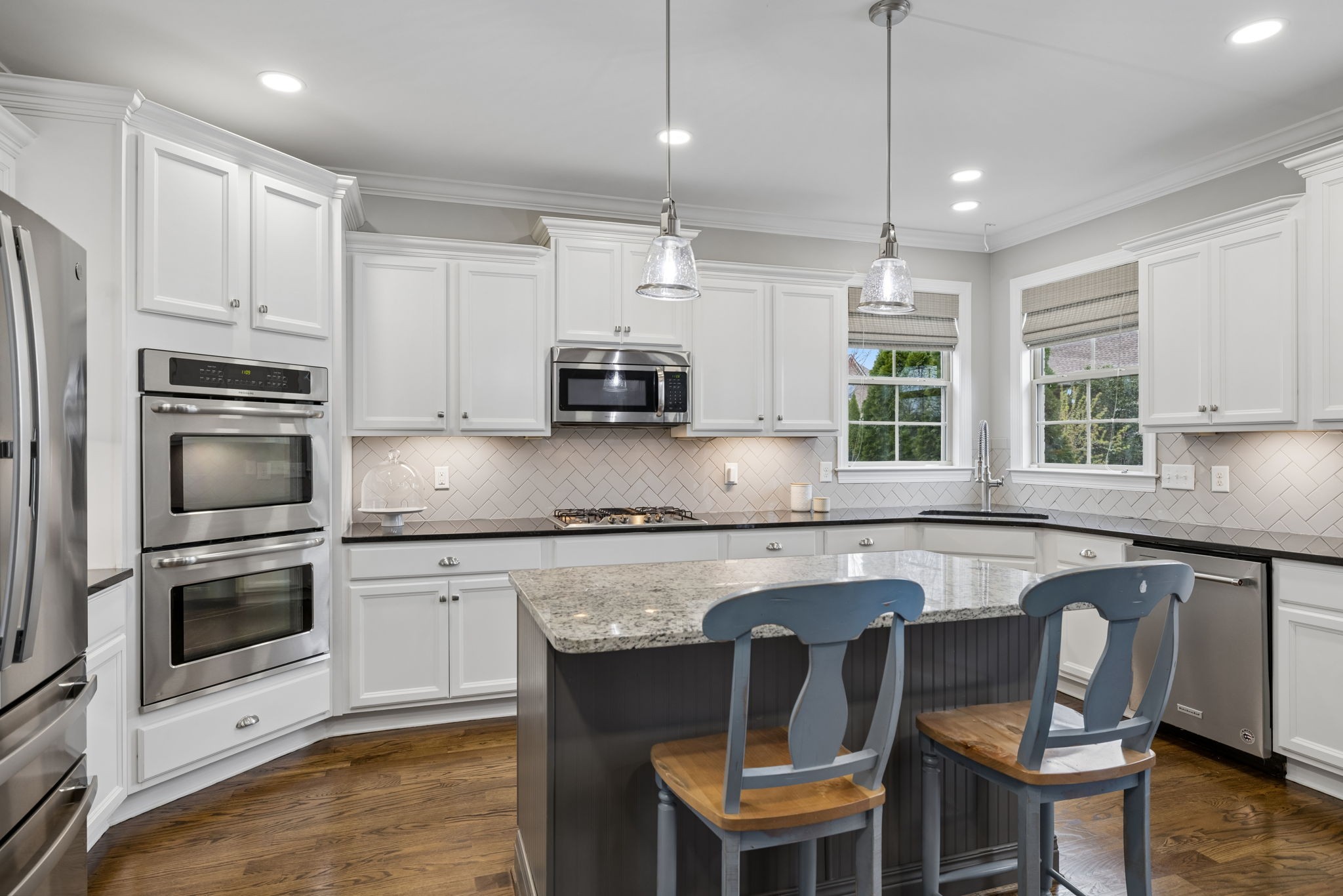 7005 Salmon Run Spring Hill, TN 37174 - Photo 33 of 85 a kitchen with stainless steel appliances granite countertop a stove a sink a microwave a refrigerator and cabinets