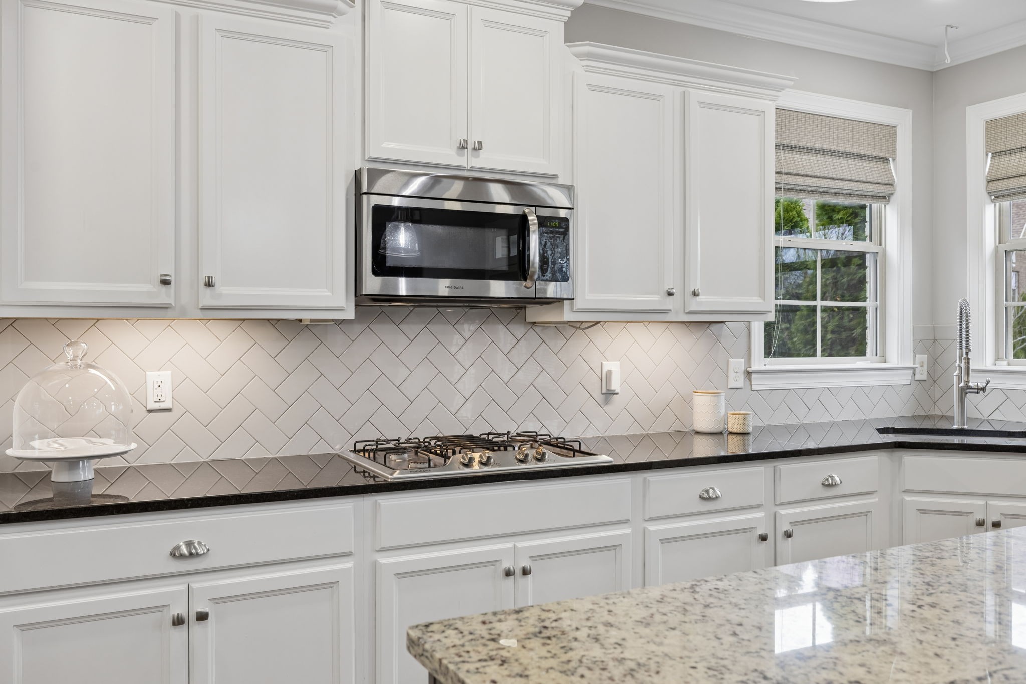 7005 Salmon Run Spring Hill, TN 37174 - Photo 35 of 85 a kitchen with granite countertop white cabinets and a sink