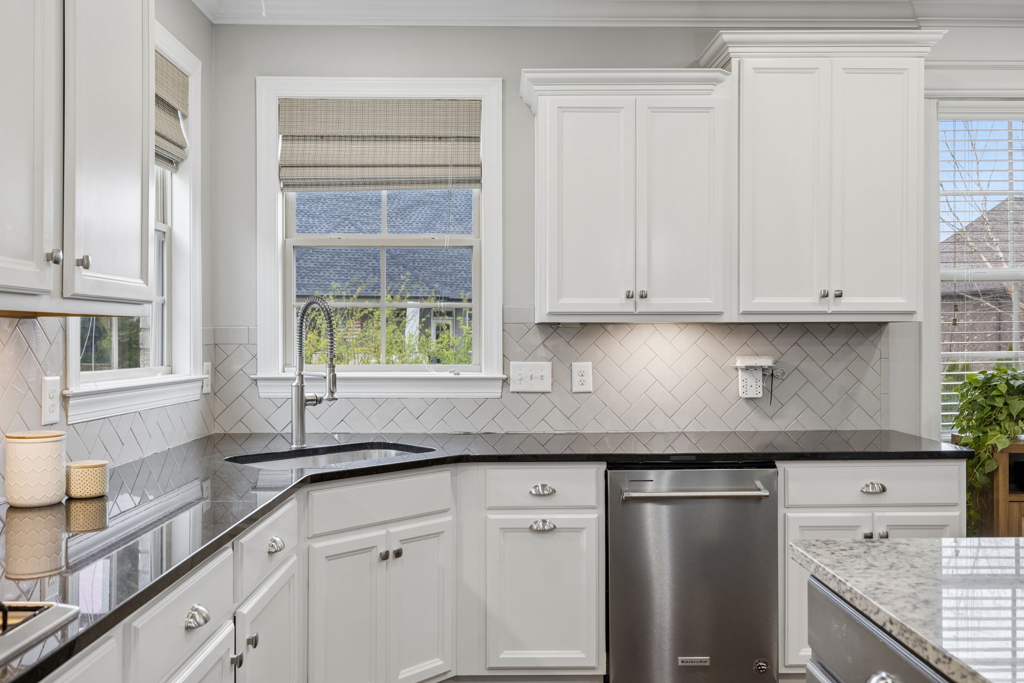 7005 Salmon Run Spring Hill, TN 37174 - Photo 38 of 85 a kitchen with stainless steel appliances granite countertop white cabinets and a window