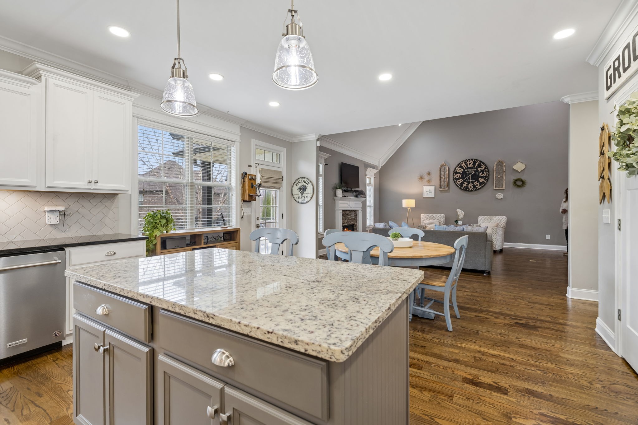 7005 Salmon Run Spring Hill, TN 37174 - Photo 39 of 85 a kitchen with a table chairs and wooden floor