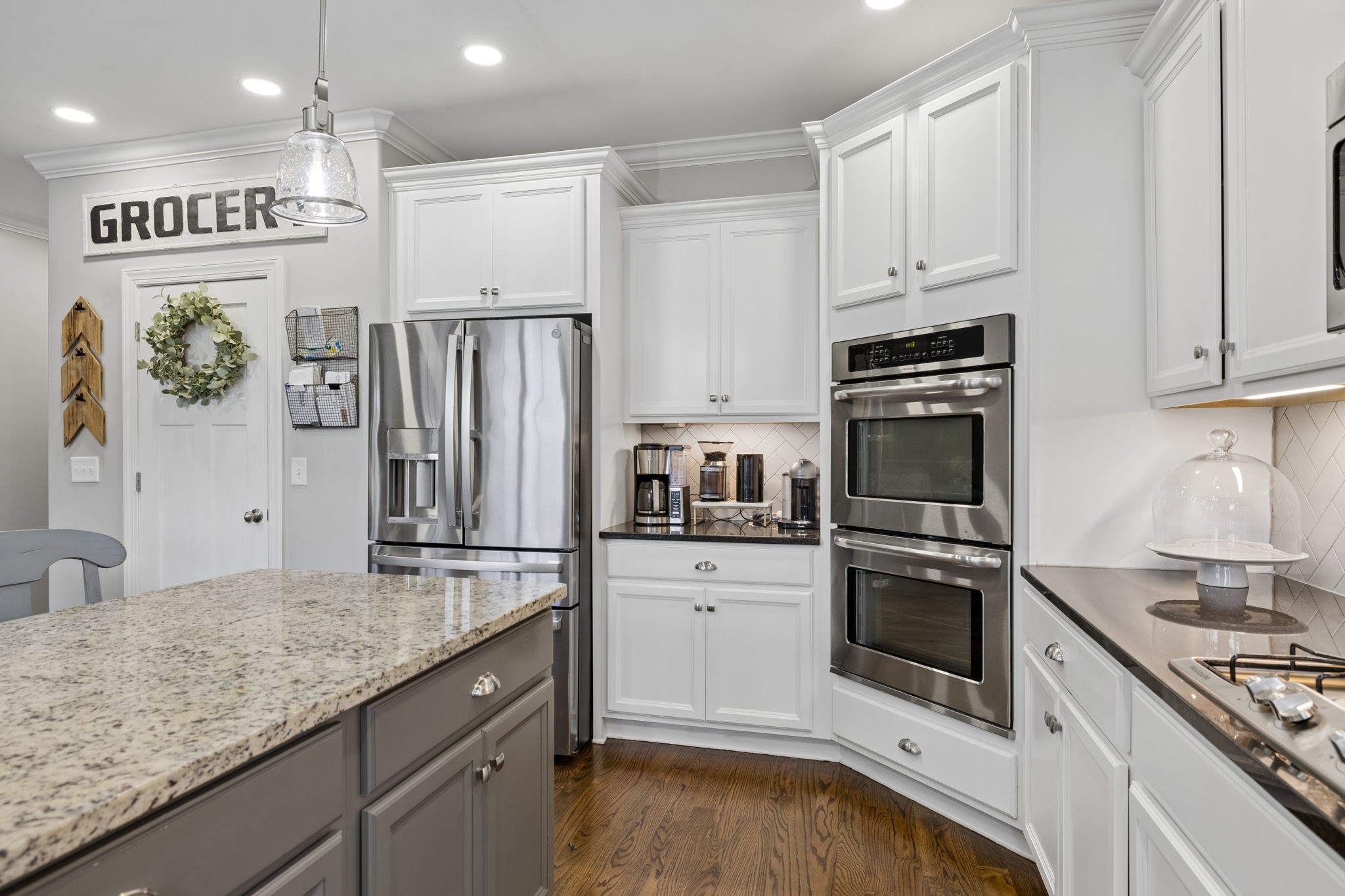 7005 Salmon Run Spring Hill, TN 37174 - Photo 44 of 85 a kitchen with granite countertop a refrigerator stove and sink