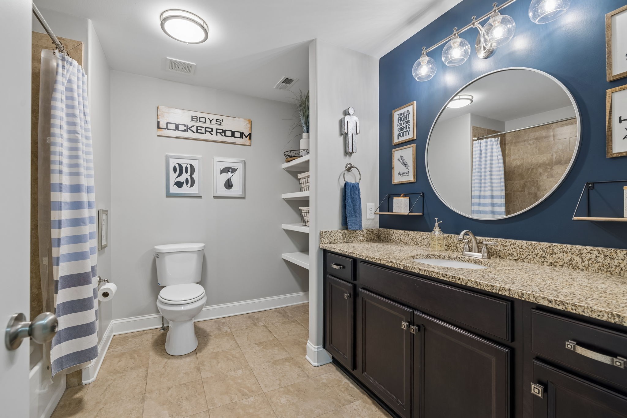 7005 Salmon Run Spring Hill, TN 37174 - Photo 65 of 85 a bathroom with a granite countertop toilet a sink and a mirror