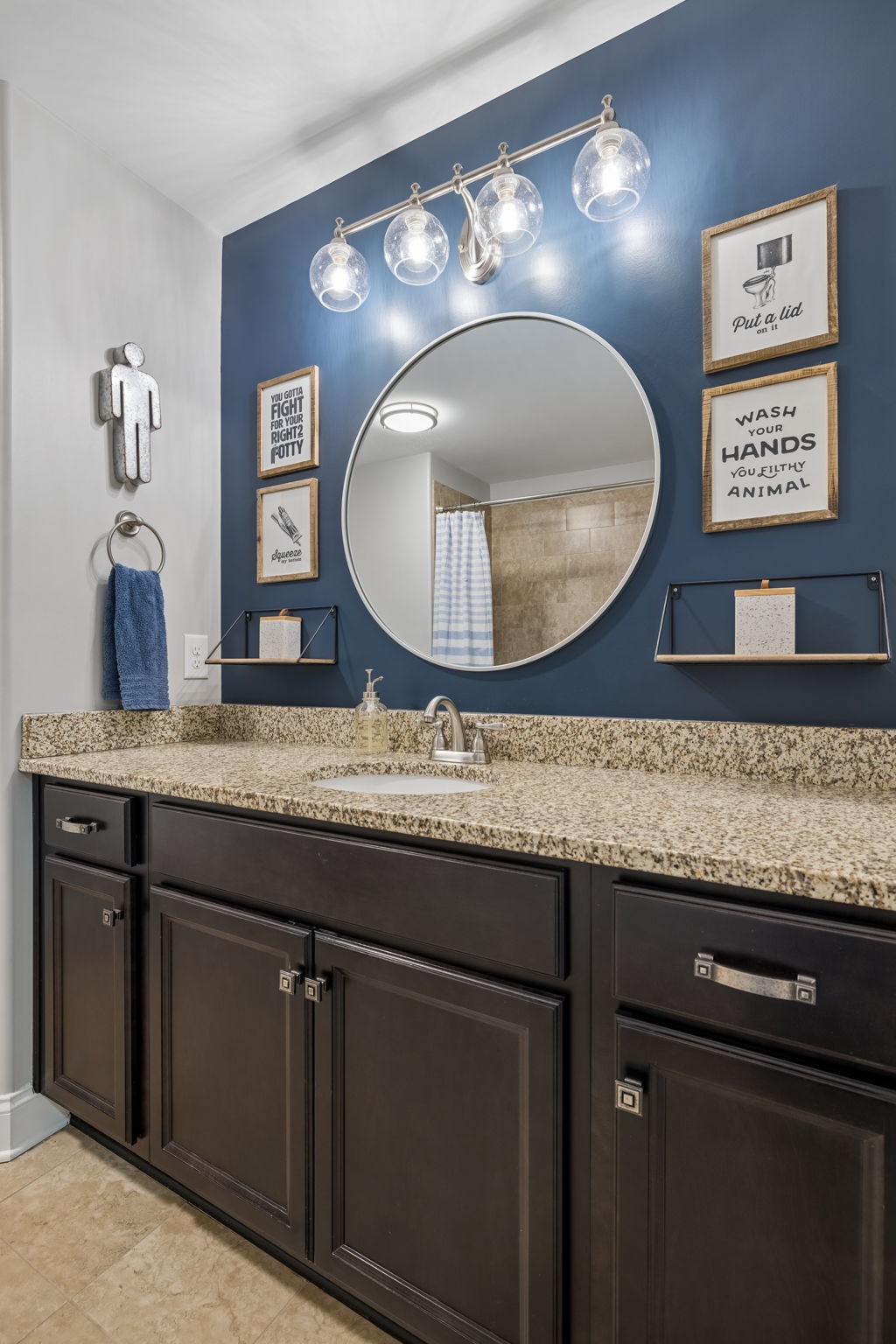7005 Salmon Run Spring Hill, TN 37174 - Photo 66 of 85 a bathroom with a granite countertop sink and a mirror