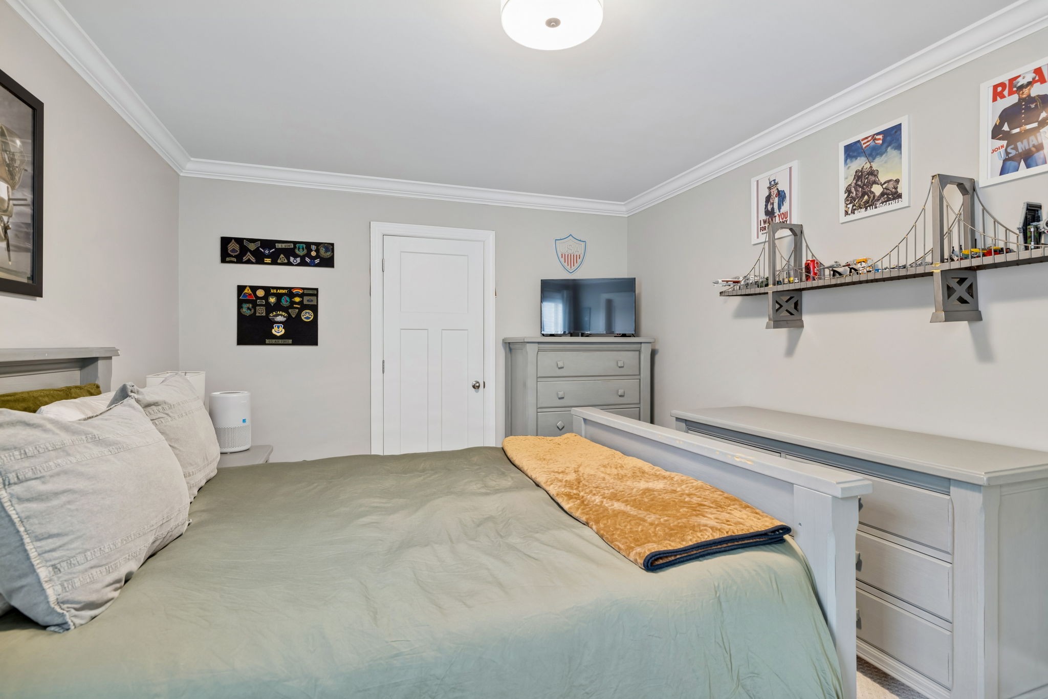 7005 Salmon Run Spring Hill, TN 37174 - Photo 70 of 85 a bedroom with a bed and painting on the wall