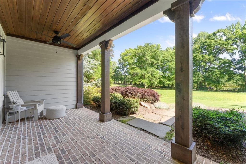 5822 John Burruss Road Cumming, GA 30040 - Photo 11 of 65 a view of a porch with furniture and yard