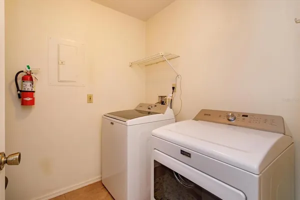 a utility room with dryer and washer