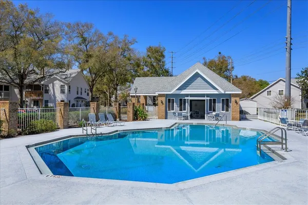 a view of house with a swimming pool