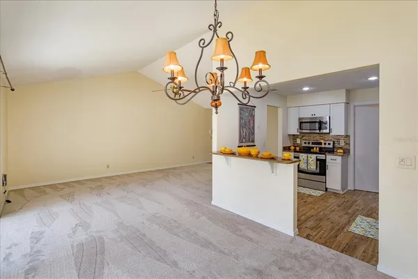 a view of a kitchen with microwave and cabinets