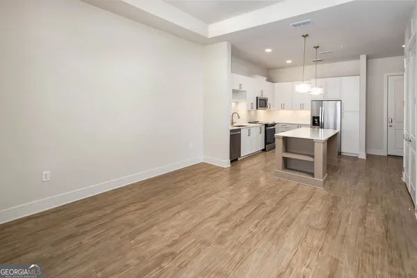 a view of kitchen with wooden floor