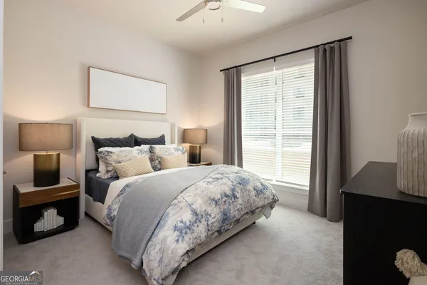 a bedroom with a bed and a window