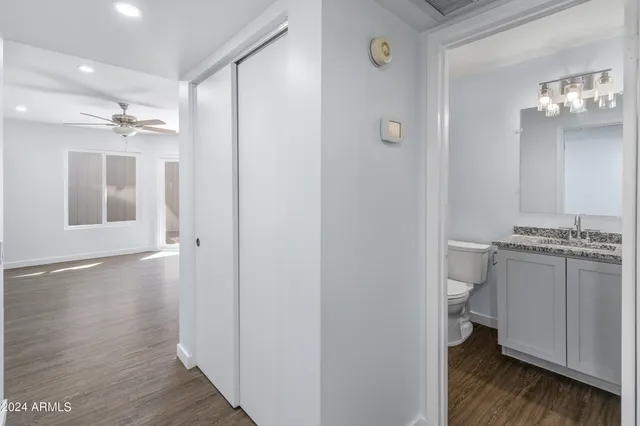 a bathroom with a double vanity sink and mirror