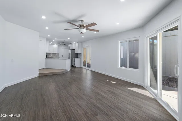 a view of a kitchen with a sink and a window