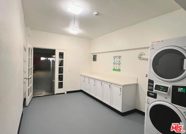 a view of a storage & utility room with washer and dryer