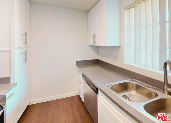 a kitchen with a sink and a window