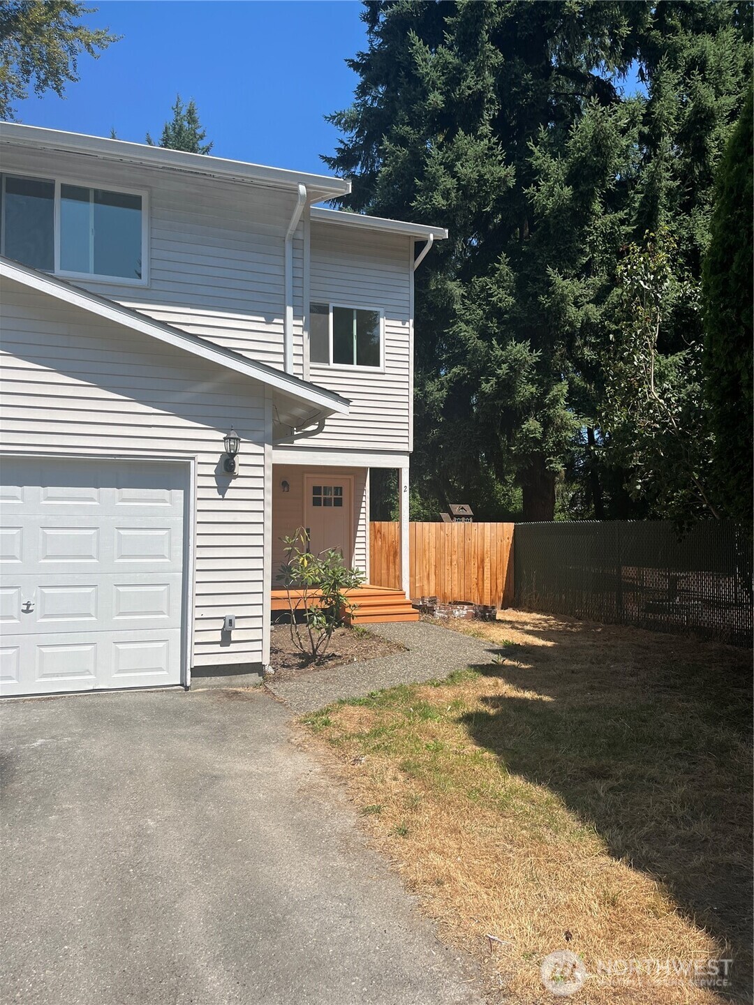 411 170th Place Southwest, Unit 2 Bothell, WA 98012 - Photo 1 of 15 a view of a house with backyard