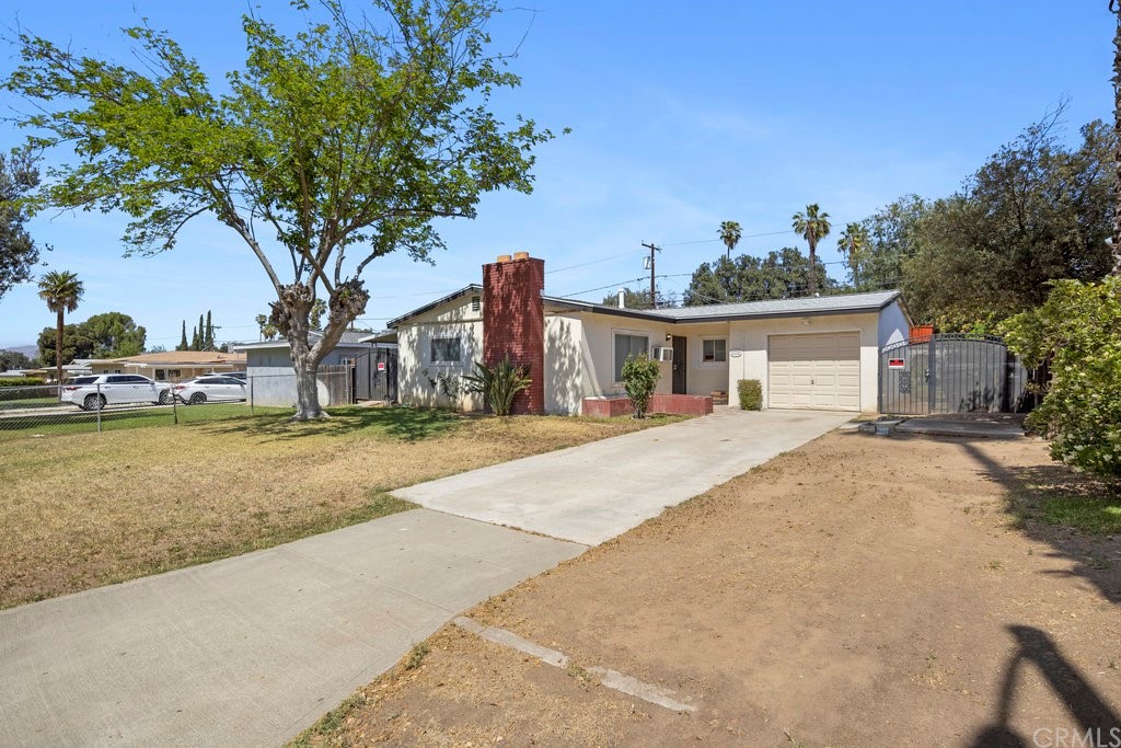 3129 Ronald Street Riverside, CA 92506 - Photo 2 of 37 a house with trees in front of it