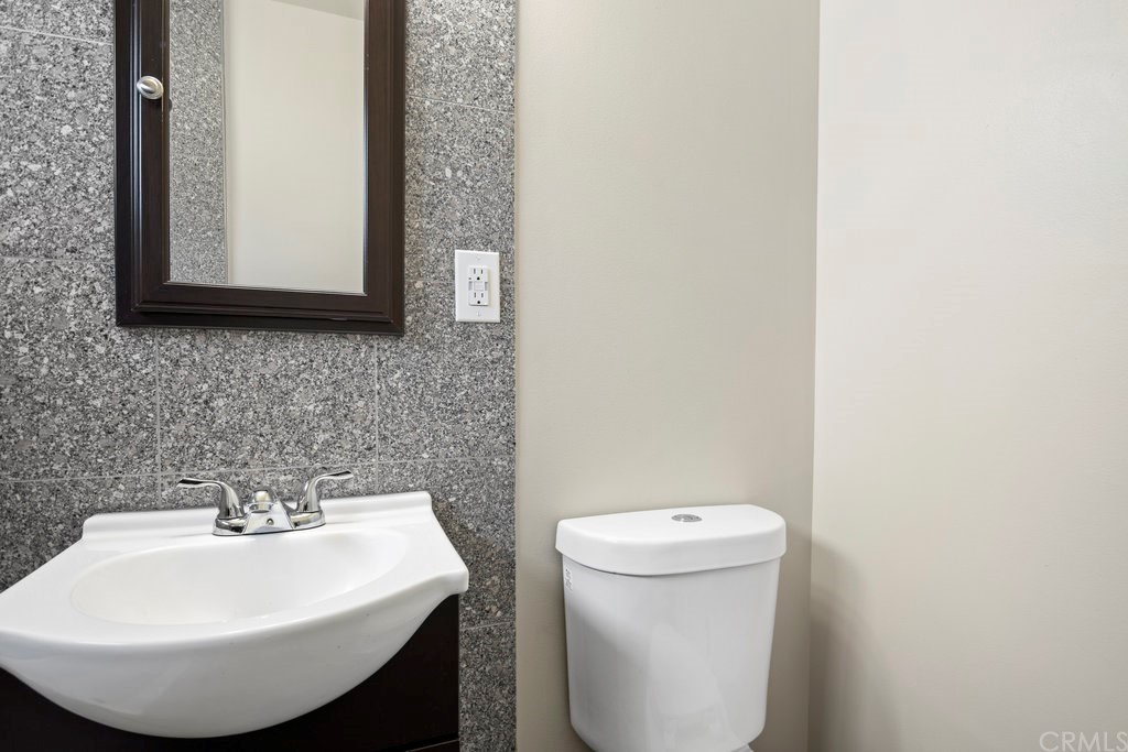3129 Ronald Street Riverside, CA 92506 - Photo 27 of 37 a bathroom with a sink and a toilet
