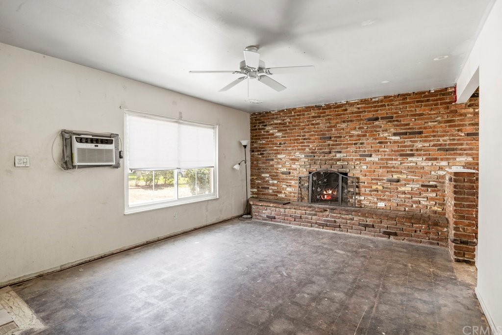 3129 Ronald Street Riverside, CA 92506 - Photo 10 of 37 an empty room with windows and fireplace