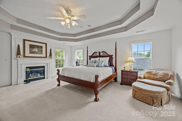 a bedroom with a bed and a fireplace