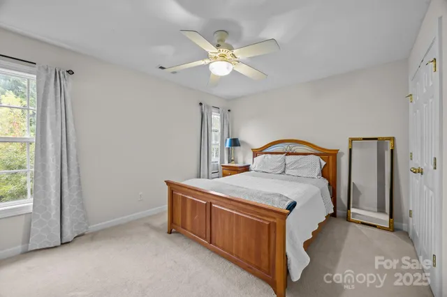 a bedroom with a bed and window