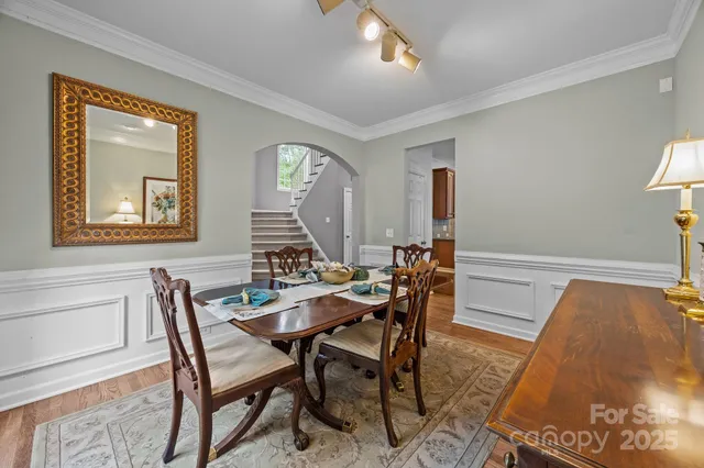 a view of a dining room with furniture and window