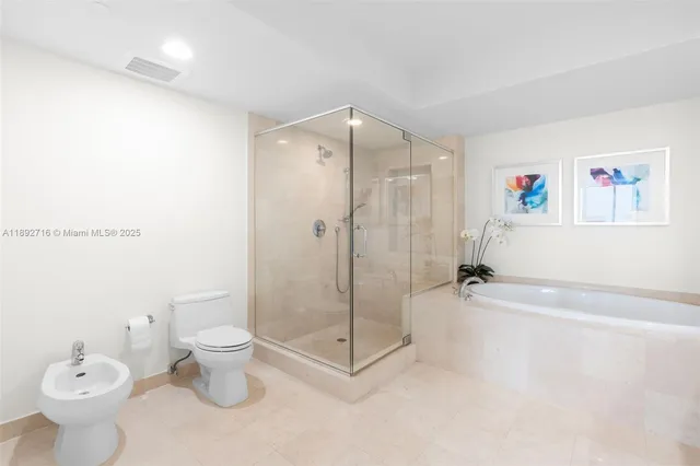 a spacious bathroom with a shower a toilet and a sink