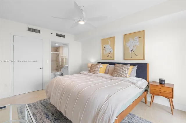 a bedroom with a bed and a table