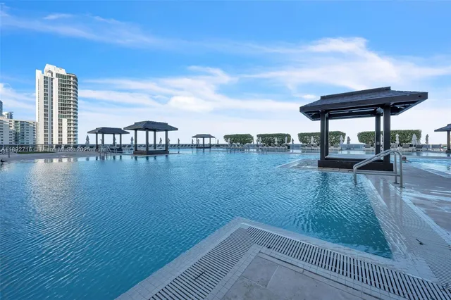 a view of swimming pool with furniture