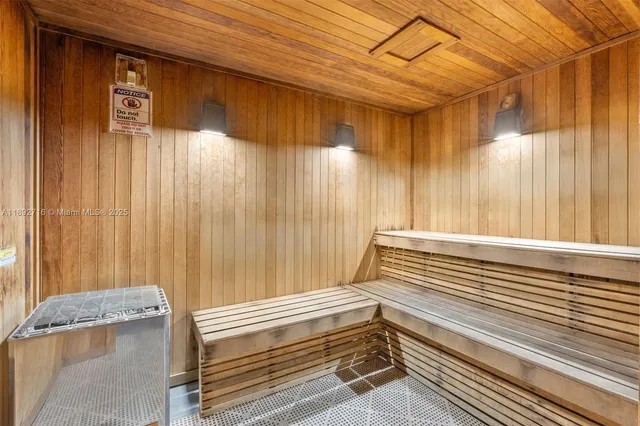 a bathroom with a shower and mirror