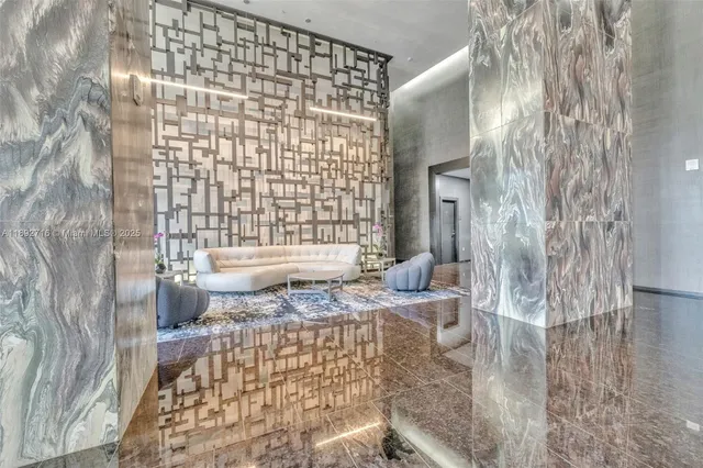 a view of a living room and entry way