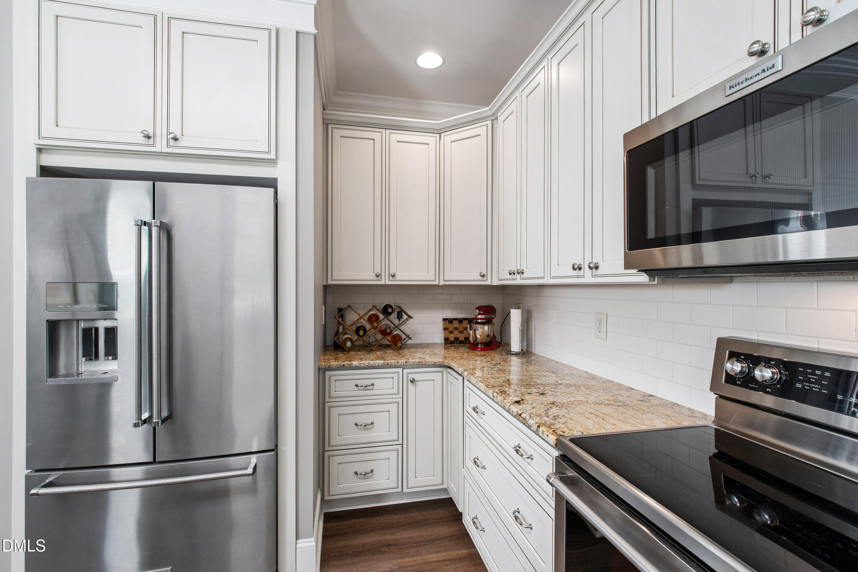 5505 Spring Road Raleigh, NC 27603 - Photo 19 of 41 a kitchen with stainless steel appliances granite countertop a refrigerator sink and cabinets