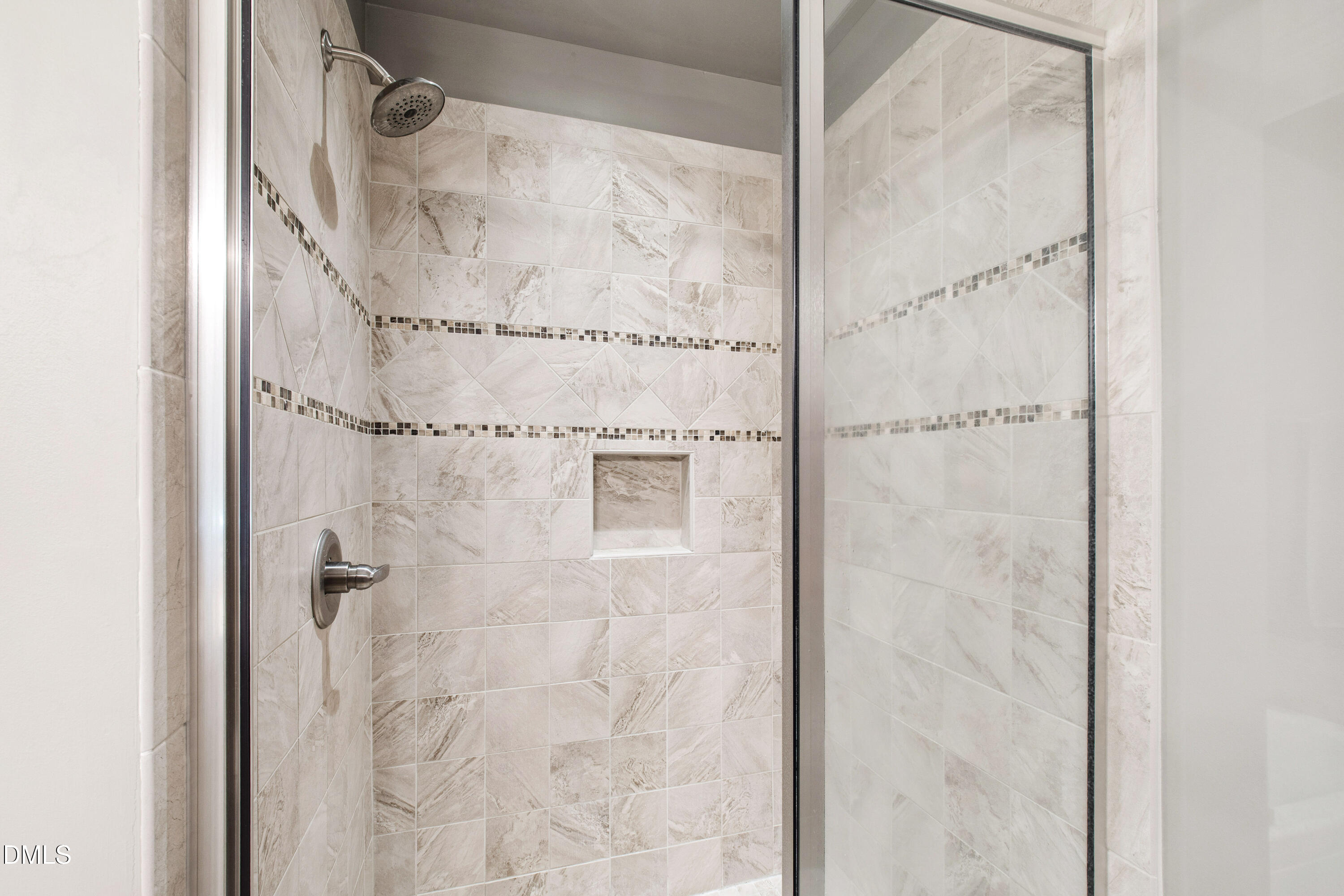 5505 Spring Road Raleigh, NC 27603 - Photo 27 of 41 a bathroom with a glass shower door