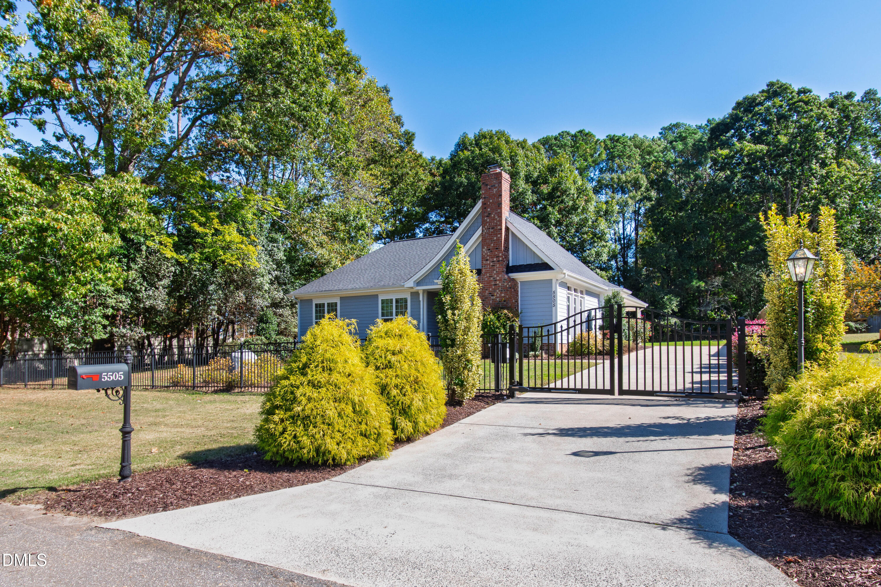 5505 Spring Road Raleigh, NC 27603 - Photo 3 of 41 a front view of a house with a garden