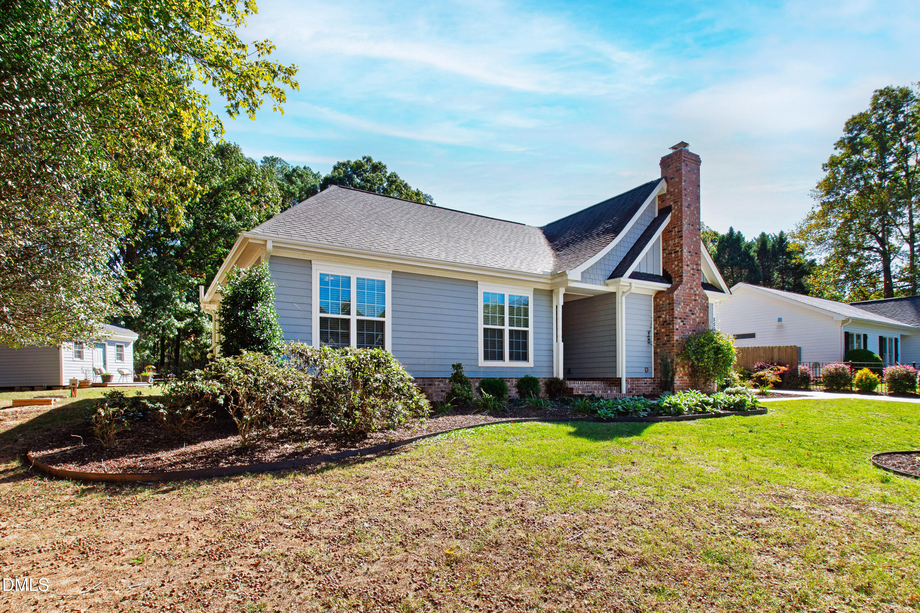 5505 Spring Road Raleigh, NC 27603 - Photo 5 of 41 a front view of house with yard outdoor seating and barbeque oven